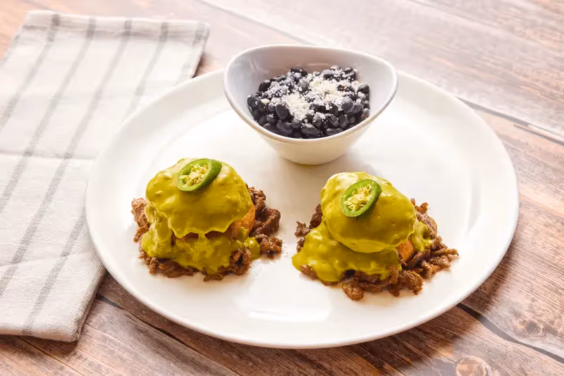 Sweet corn cakes topped with carne asada, poached eggs, fresh jalapenos and our signature housemade poblano sauce.