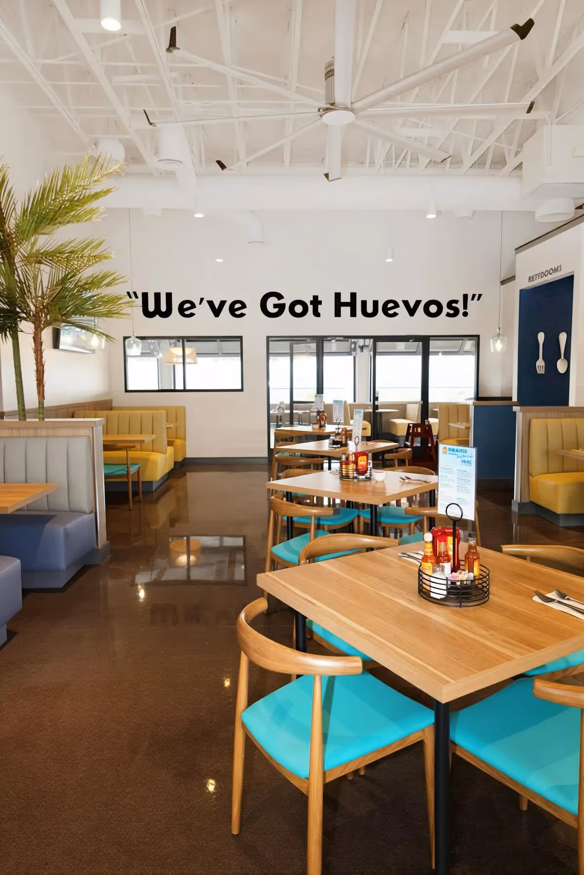 Broken Yolk Cafe Lake Havasu Arizona interior with We Got Huevos wall sign and teal accents