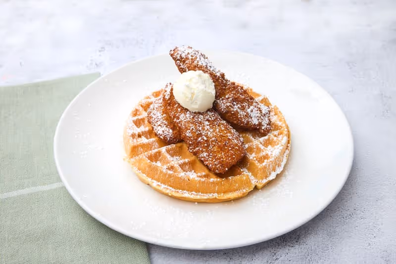Belgian waffle, crispy fried chicken, powdered sugar, whipped butter.