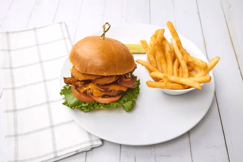 Applewood-smoked bacon, onion rings, cheddar cheese, lettuce, tomato, mayo and tangy BBQ sauce.