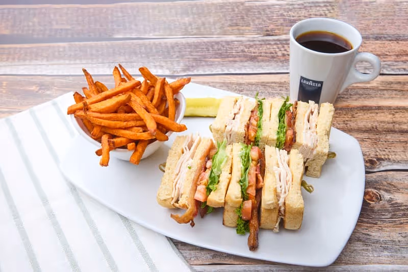 Triple-decker sandwich filled with sliced turkey, applewood-smoked bacon, lettuce, tomato and mayo on choice of toasted bread.