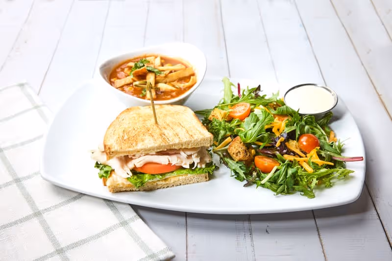 Your choice of soup, salad, and half a sandwich.
