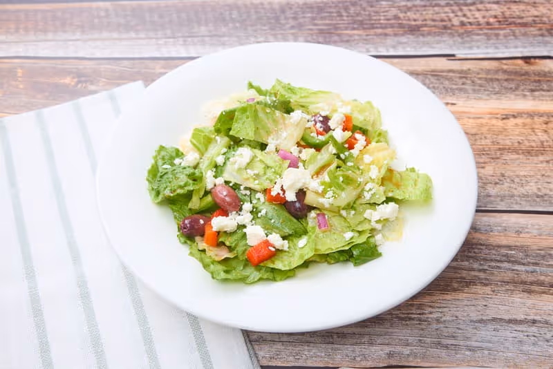 Feta cheese, Kalamata olives, red and green bell pepper, red onion, diced tomato and Romaine lettuce with balsamic vinaigrette.