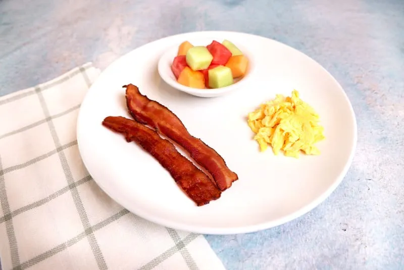 Hand-cracked eggs with your choice of two sides and a drink.