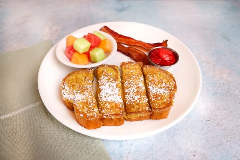 Four french toast sticks with your choice of two sides and a drink.