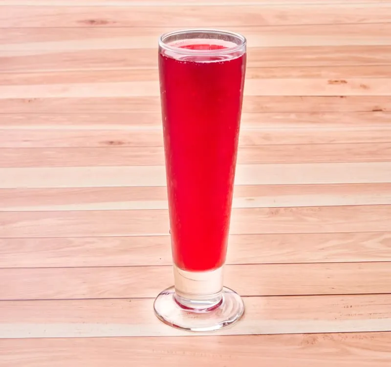 A bright and tangy superfruit juice, served chilled for a refreshing burst of flavor.