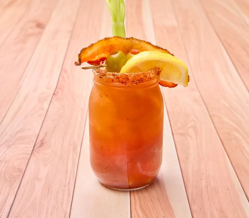 Wine-based vodka alternative. Bloody Mary mix, Tajin rim, bacon garnish.
