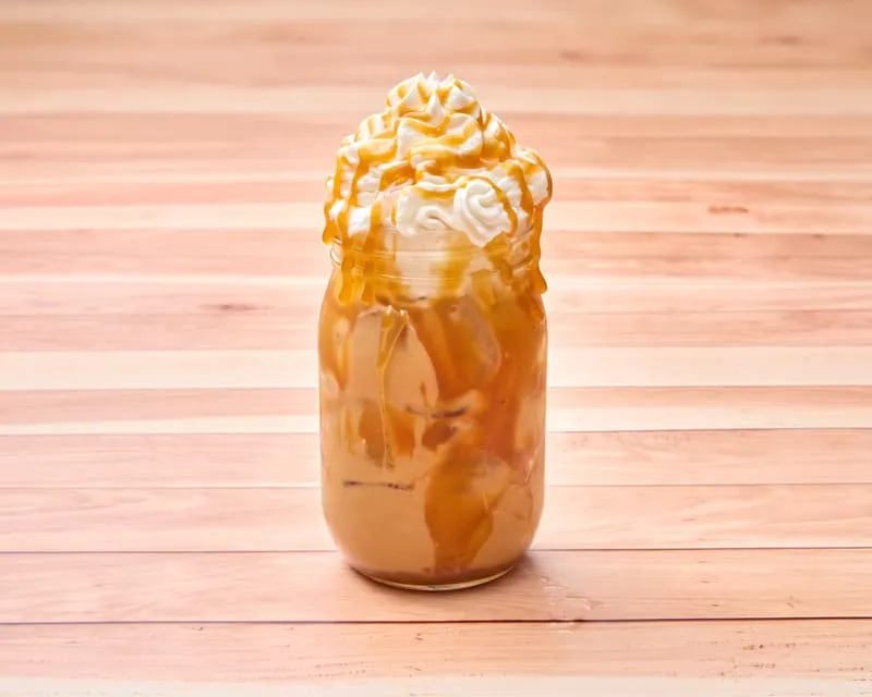 Medium roast Lavazza coffee beans blended with caramel. Topped with whipped cream and a caramel drizzle.