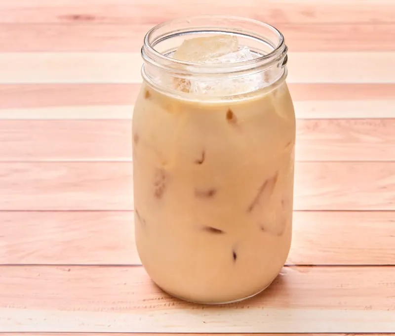 A spiced tea blend combined with steamed milk (hot) or poured over ice (iced).