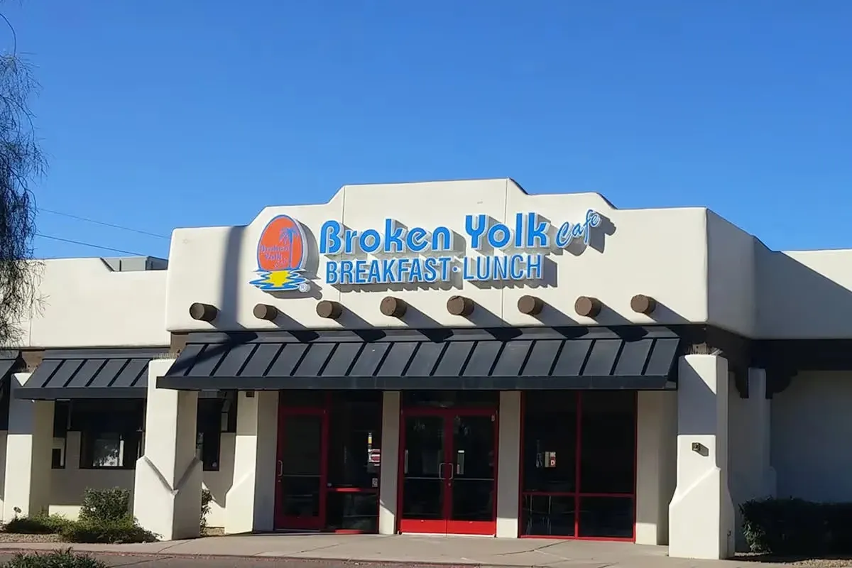 Broken Yolk Cafe Mesa Arizona exterior with adobe-style architecture and Breakfast Lunch sign