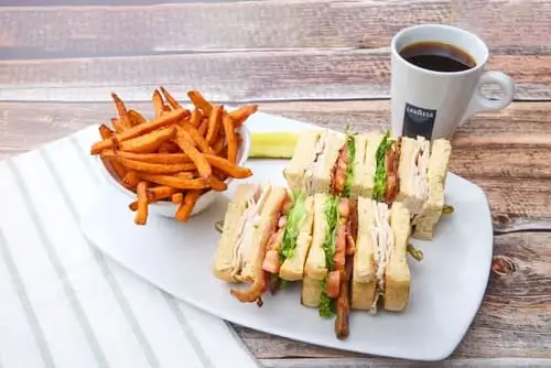 Triple-decker sandwich filled with sliced turkey, applewood-smoked bacon, lettuce, tomato and mayo on choice of toasted bread.