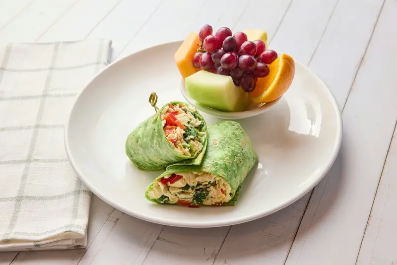 Egg whites, feta cheese, spinach, red bell pepper, spinach tortilla. Served with fresh fruit.