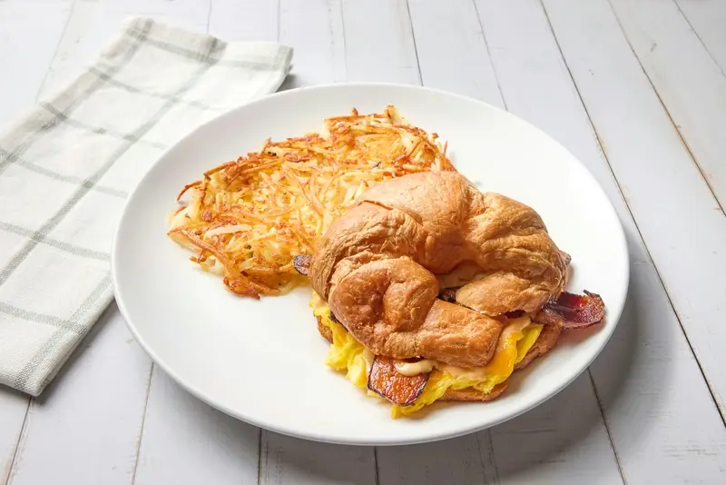 Applewood-smoked bacon, scrambled eggs, cheddar cheese and chipotle mayo on a butter croissant.