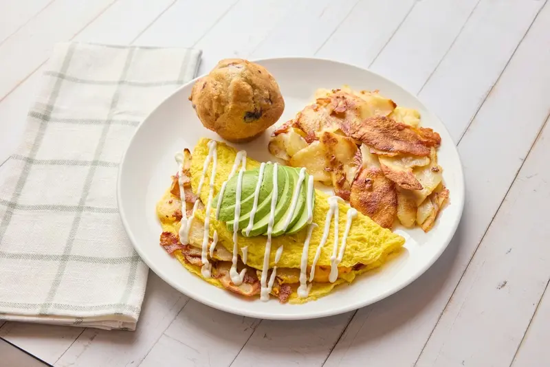 American cheese, bacon, home fries, avocado, sour cream.