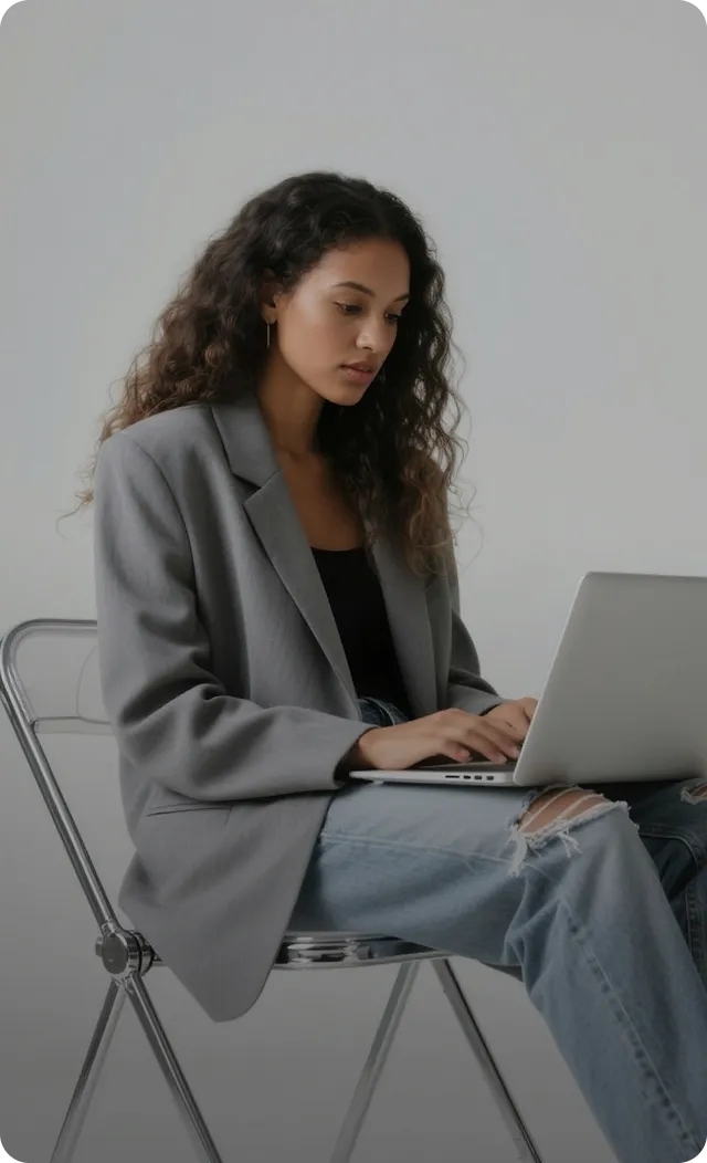 Content creator working on a laptop developing marketing materials