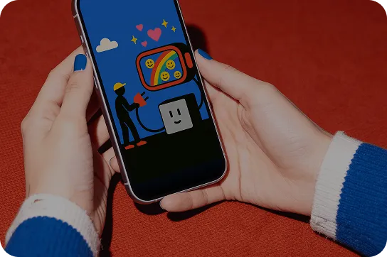 Hand holding a smartphone displaying social media advertising campaigns