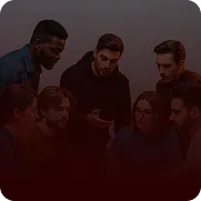 Group of people huddled together outdoors representing collaborative content creation