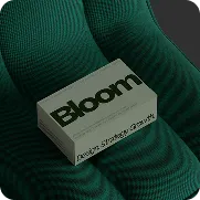 Bloom branded business card held between green sculpted hands showcasing brand strategy development