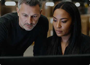 Private equity firm professionals reviewing portfolio company performance and growth metrics