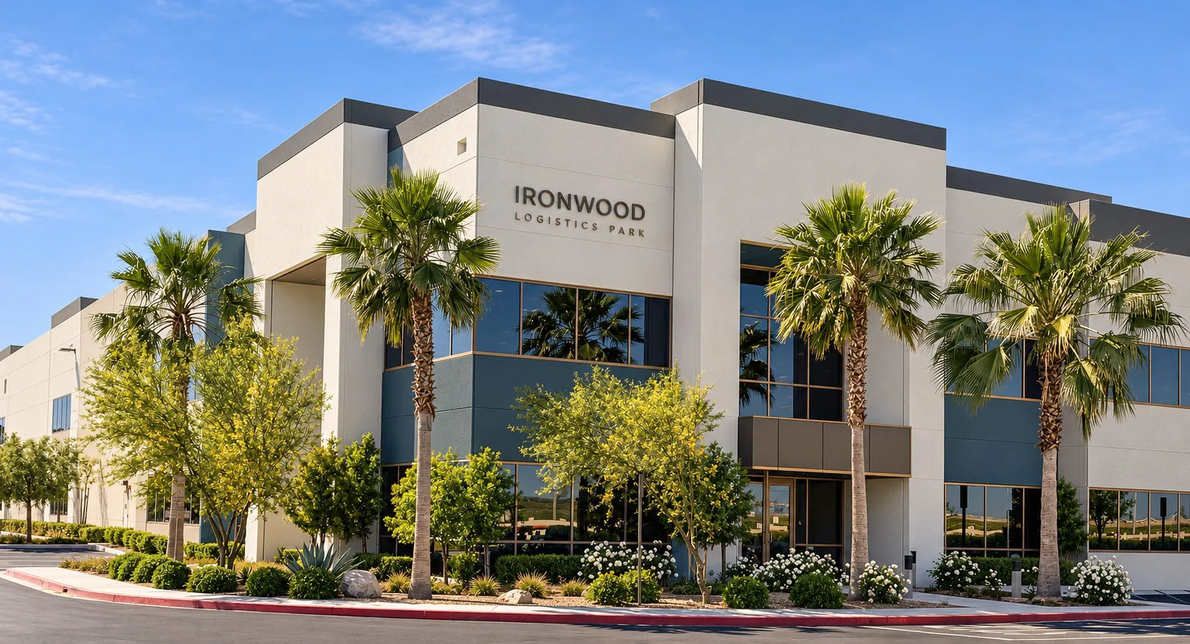 Southeast entrance of Ironwood Logistics Park with palms and a stone facade