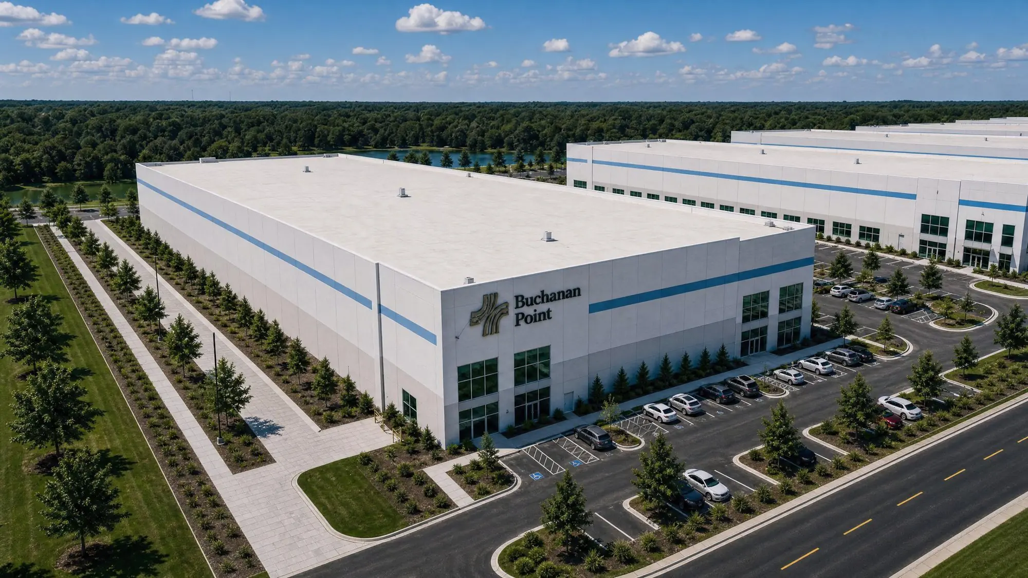 Aerial rendering of the Buchanan Point industrial building with parking and woods