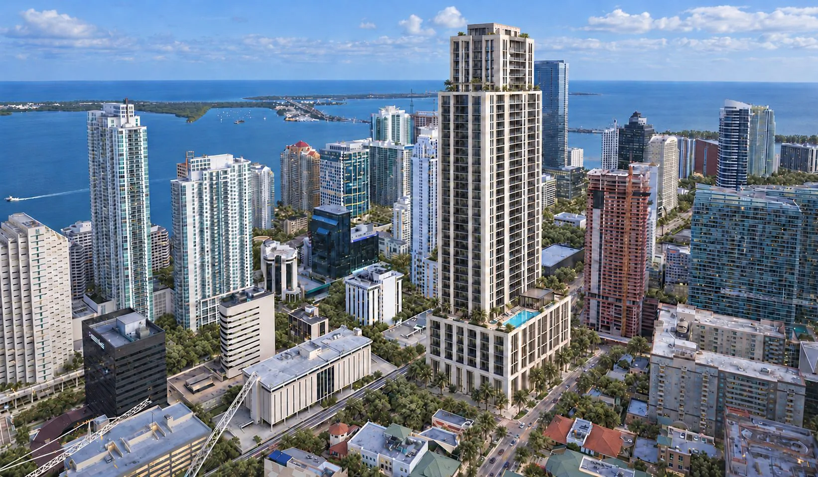 Gallery aerial of a waterfront condo tower and the downtown skyline