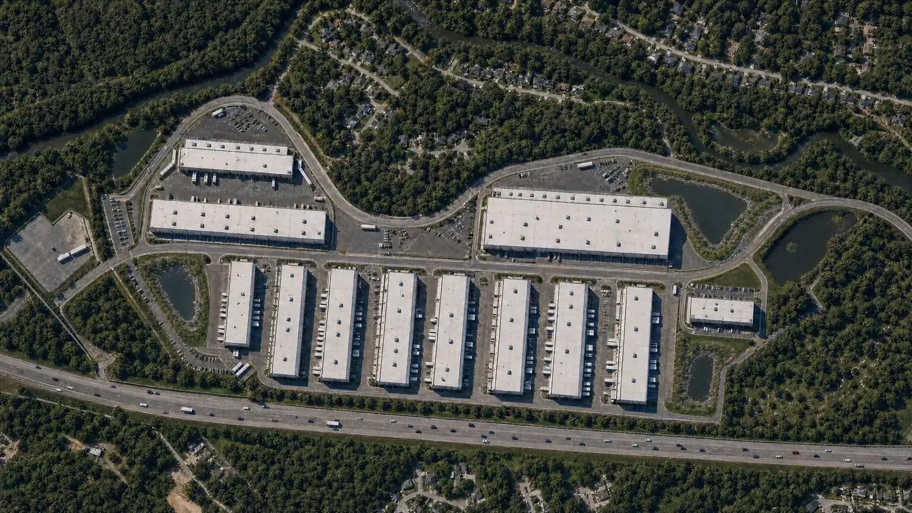 Overhead site map rendering of Buchanan Point with two large distribution buildings and rows of flex warehouses