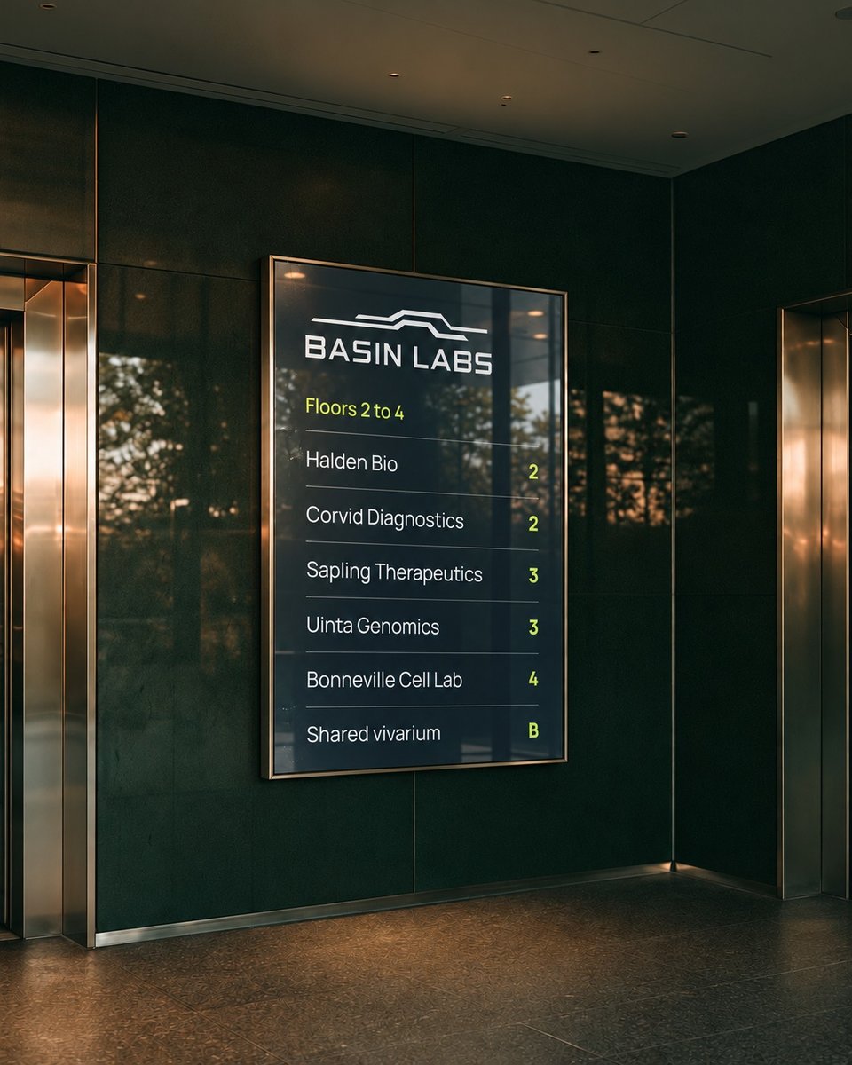 Basin Labs tenant directory in an elevator lobby