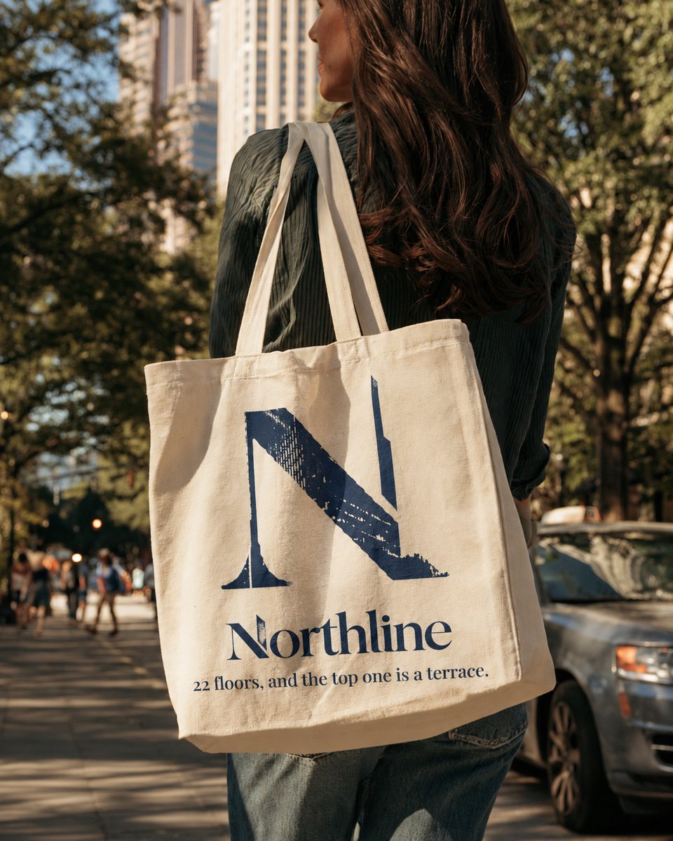 Woman carrying a Northline tote bag