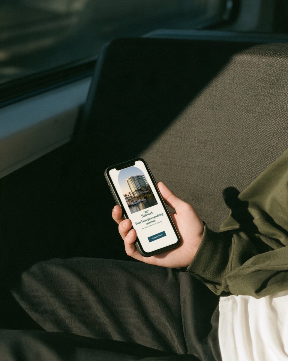 Hand holding a phone with a Saltwork Instagram story