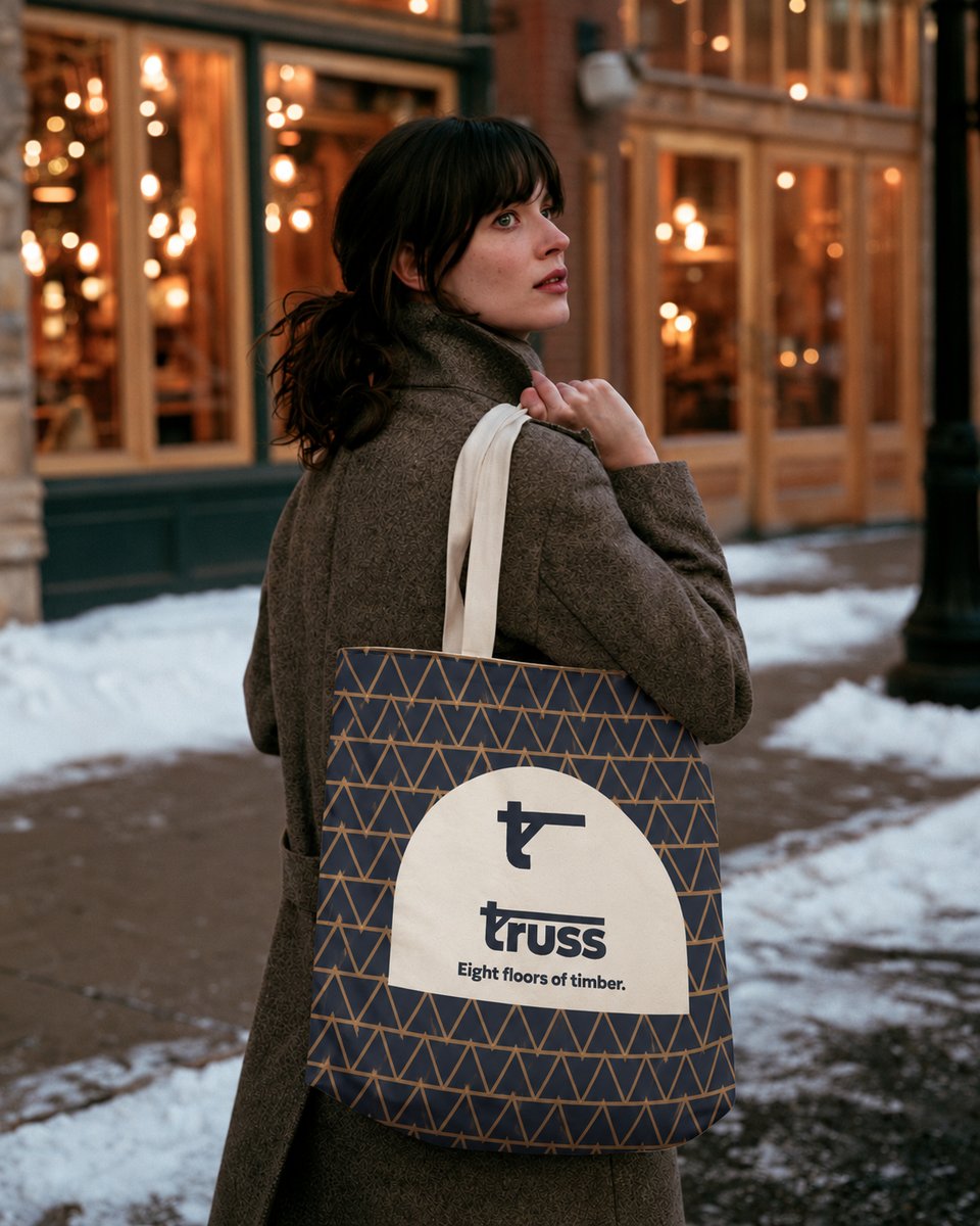 Woman carrying a Truss tote bag on a snowy street