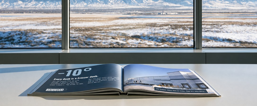 Open Ironwood brochure reading minus 10 degrees on a ledge by a window over snowy fields