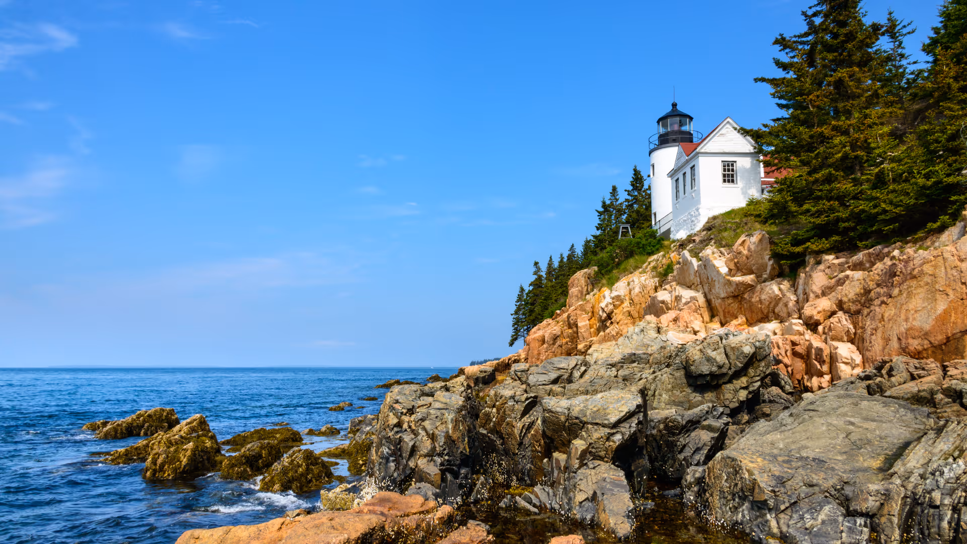 lighthouse on rocky maine coast
