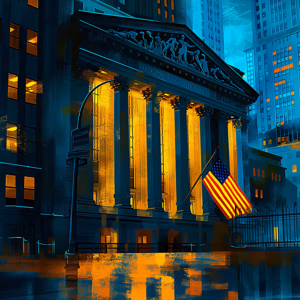 Illuminated classical building with tall columns and an American flag in front during nighttime in a cityscape.
