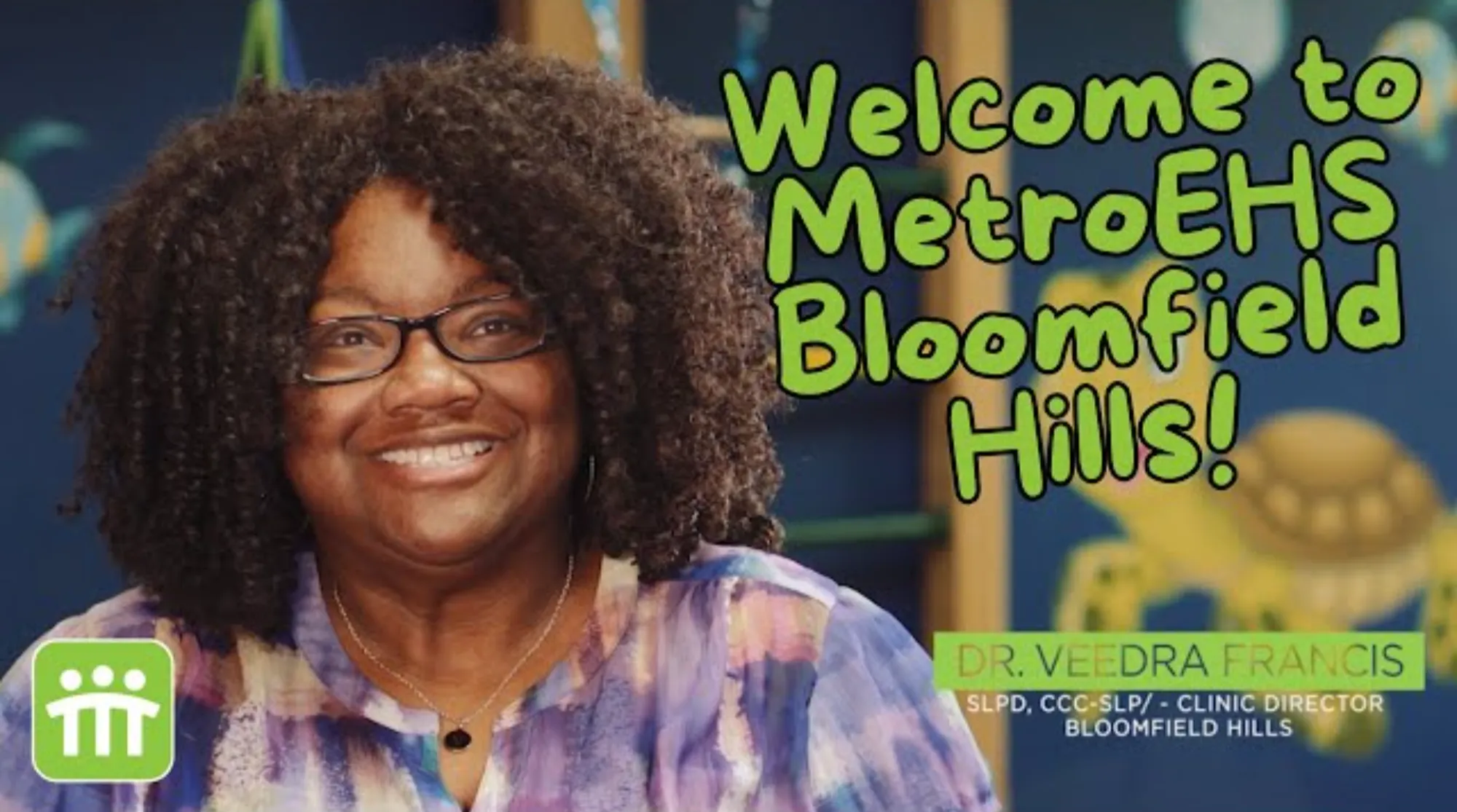 The clinic director sitting facing the camera talking about this MetroEHS clinic and what they do for children