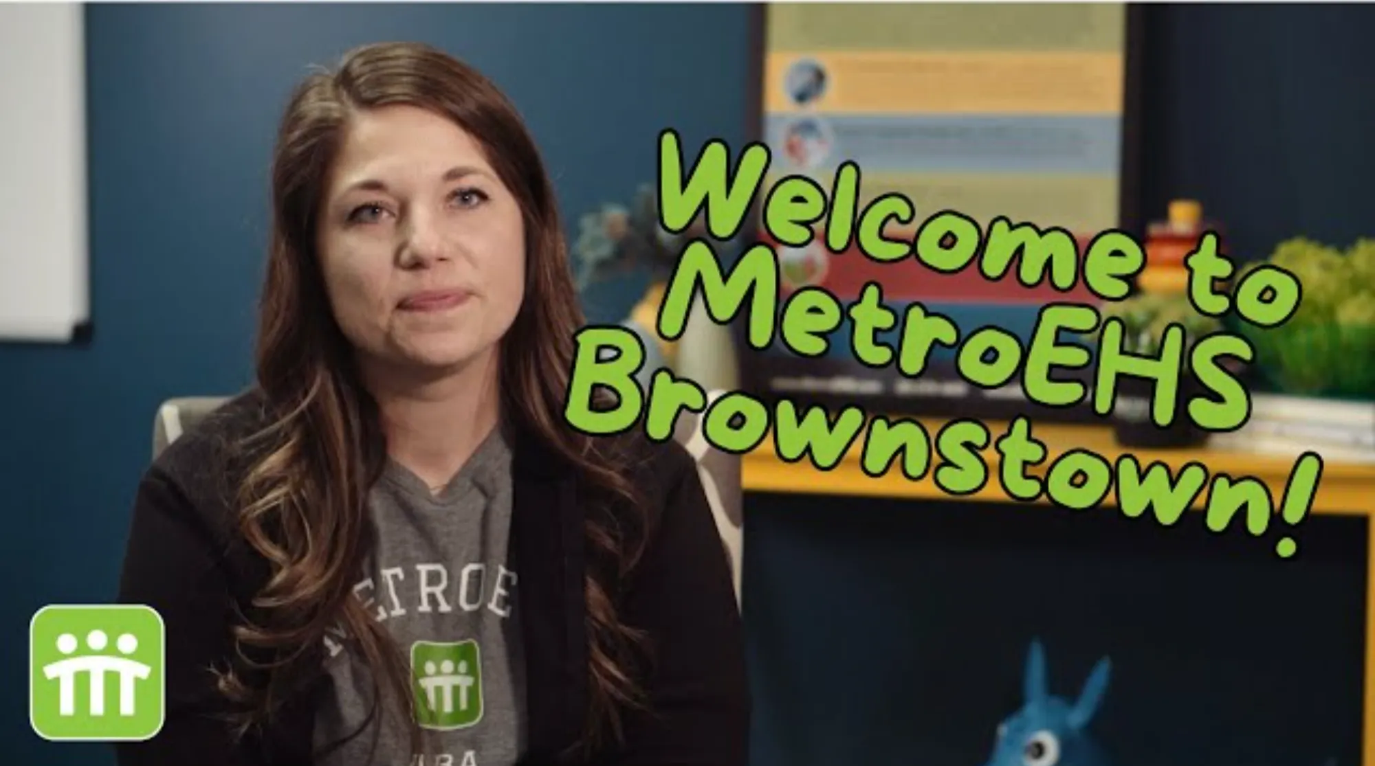 The clinic director sitting facing the camera talking about this MetroEHS clinic and what they do for children