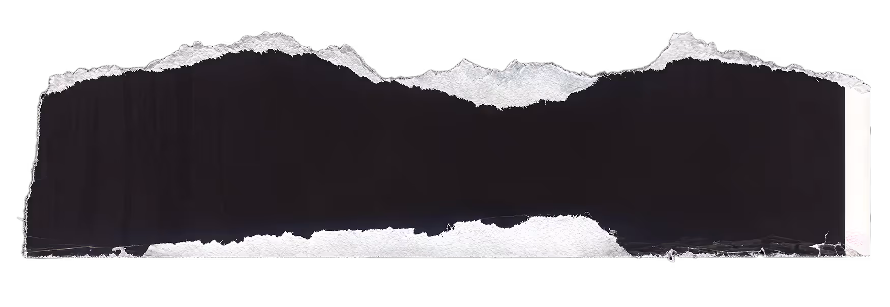Long torn piece of white paper with rough edges on a black background.