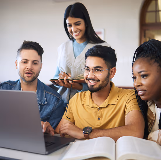 Diverse group of young leaders studying together on a laptop, supported by funds for youth education