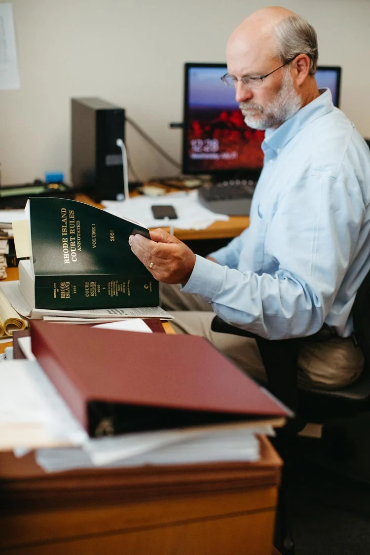 image of Lawyer consultation examining book
