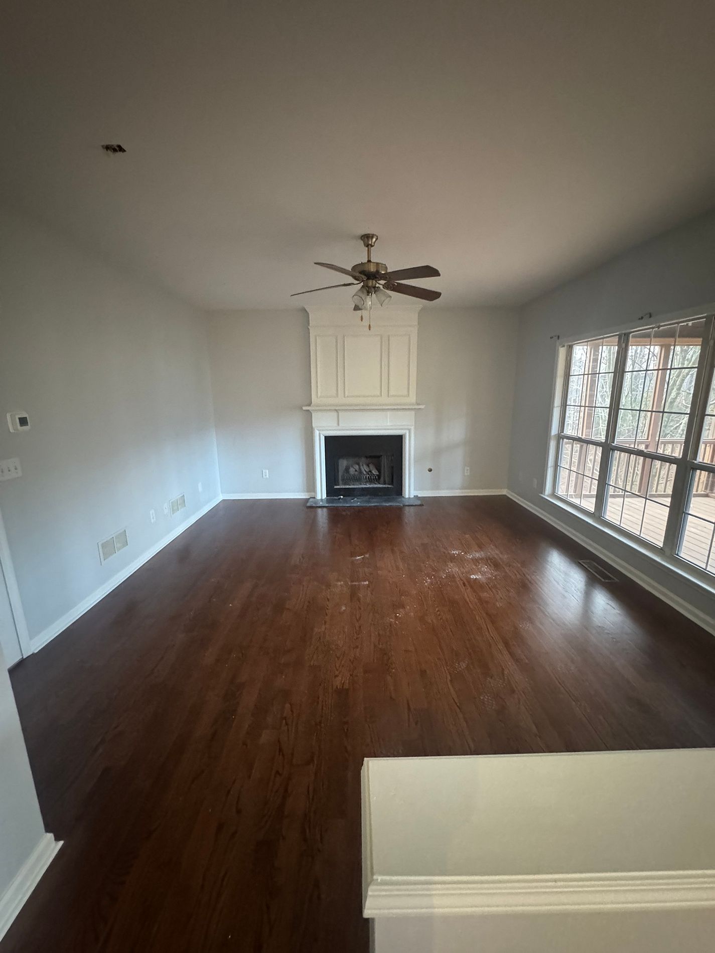 Restored living room with refinished hardwood floors in Cumming, GA