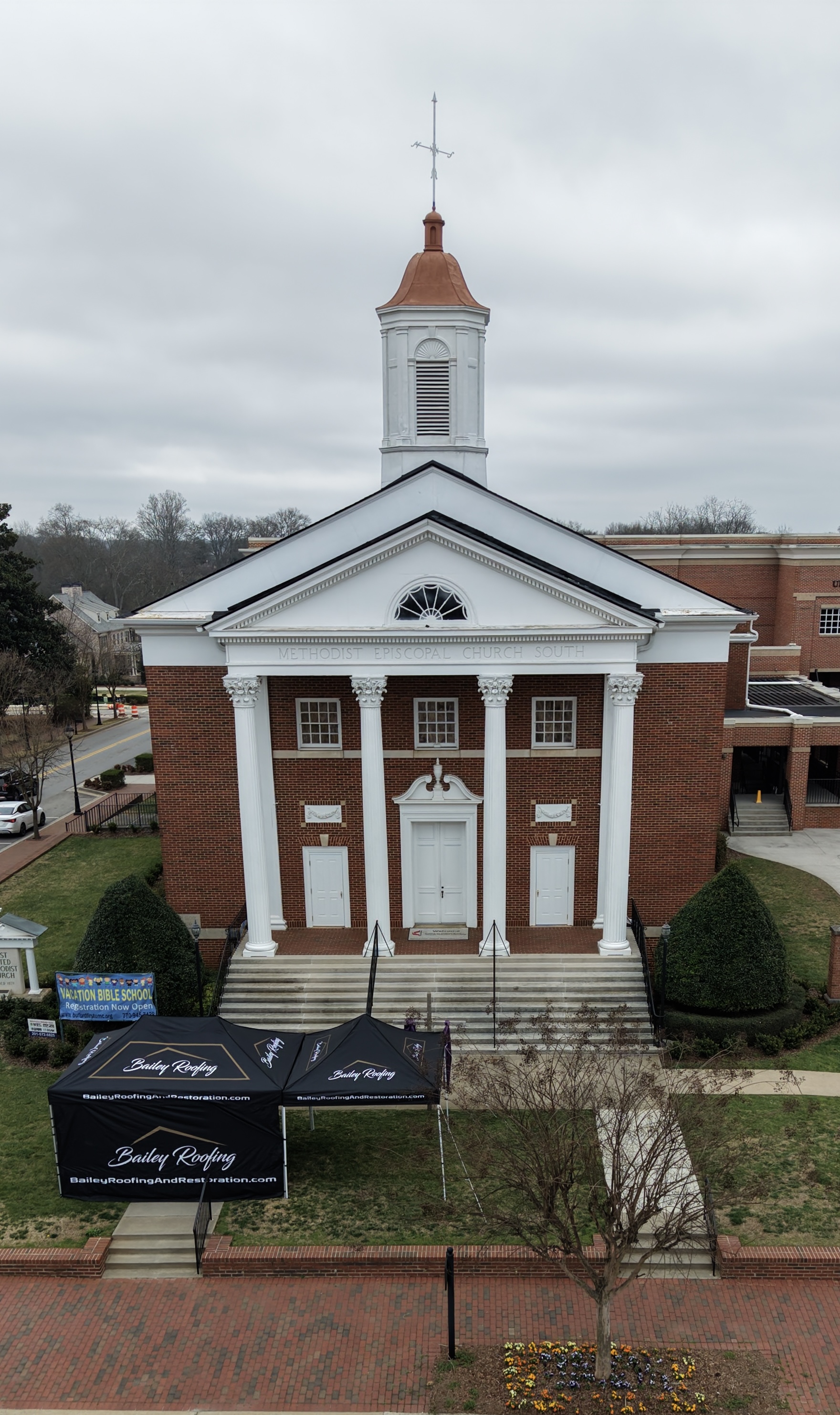 Aerial view of the completed roof replacement on Buford First United Methodist Church in Buford, GA by Bailey Roofing & Restoration