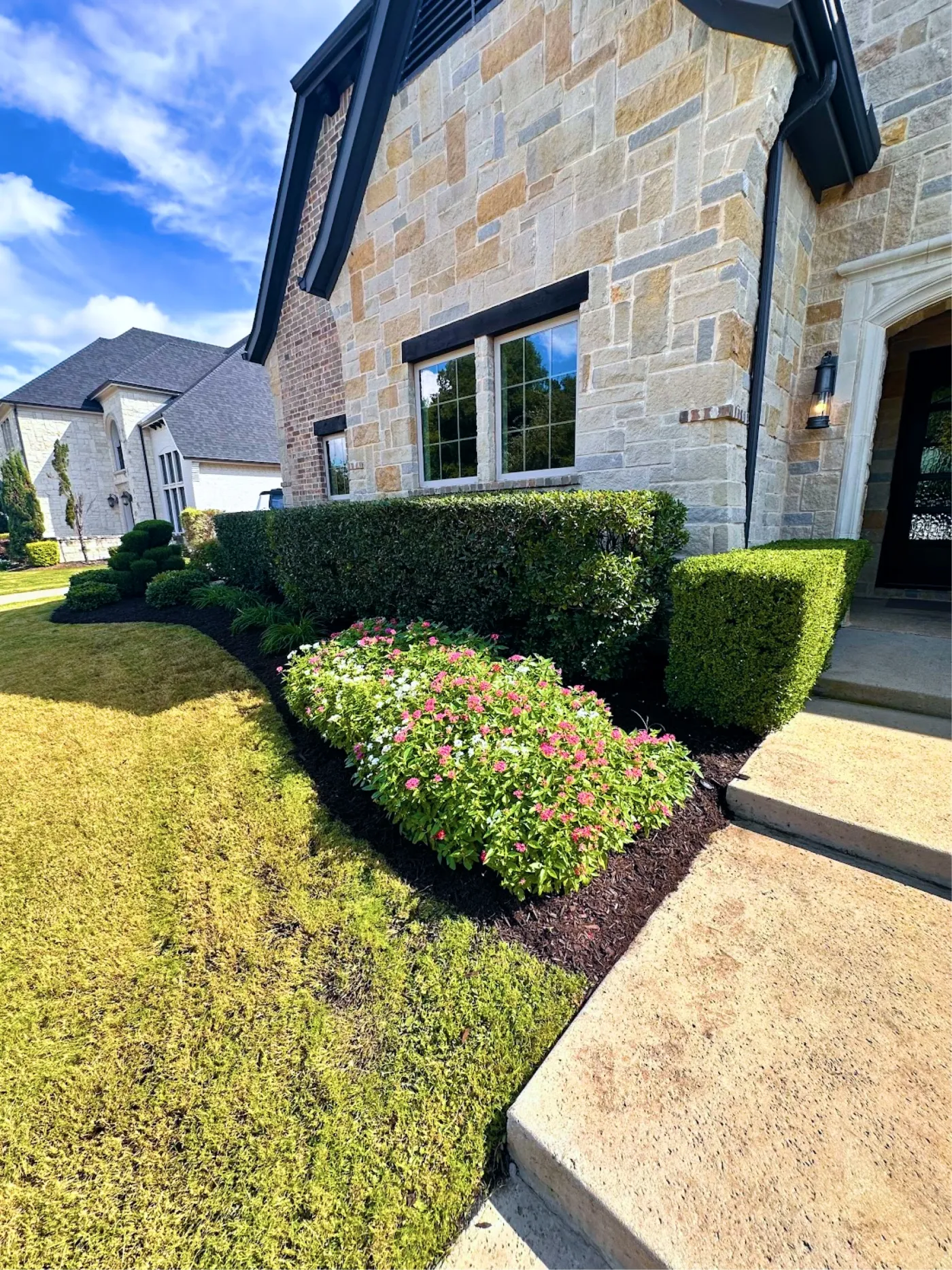 Texterra lawn care crew servicing a property in Grapevine, TX