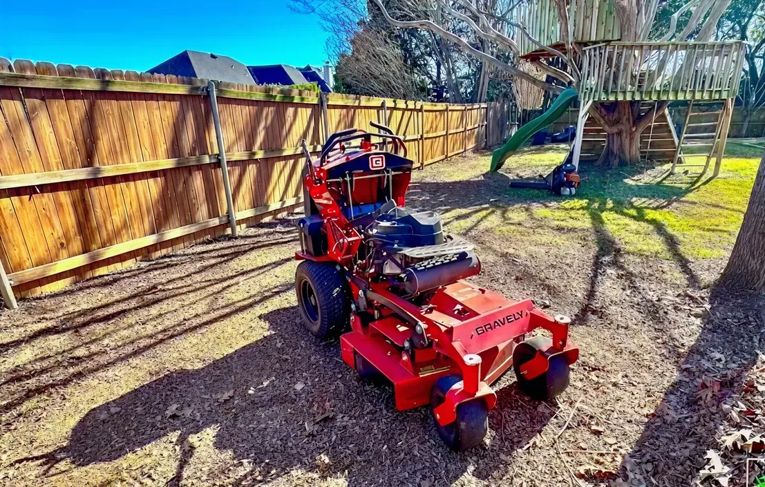 Commercial lawn mower used for residential lawn and grounds maintenance