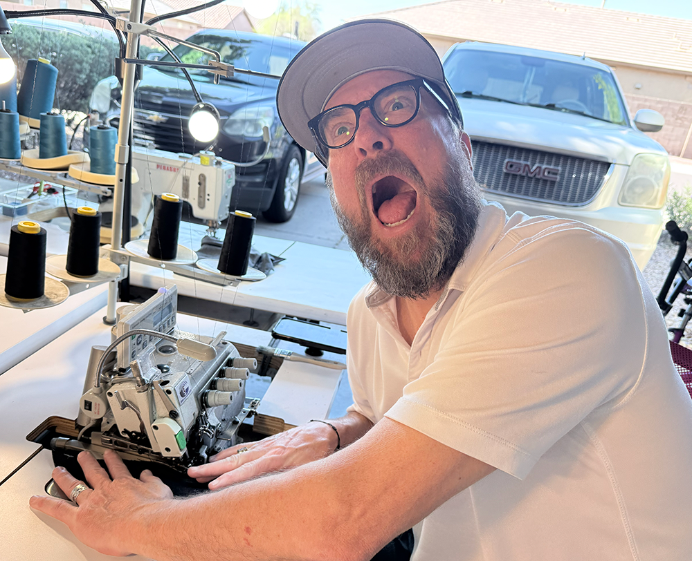 image of tailor drafting patterns