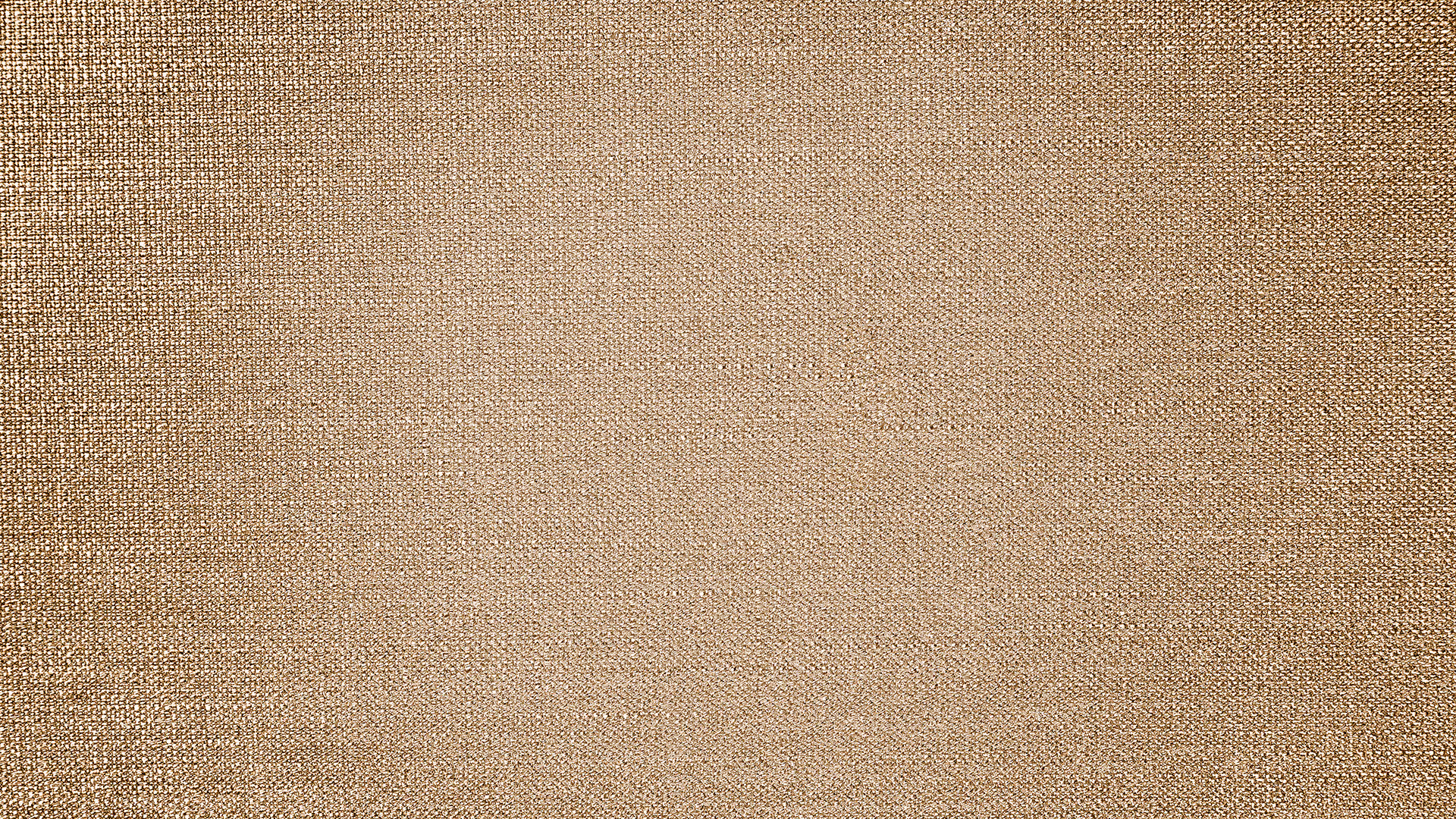 Close-up texture of woven brown linen fabric with a natural, coarse surface.