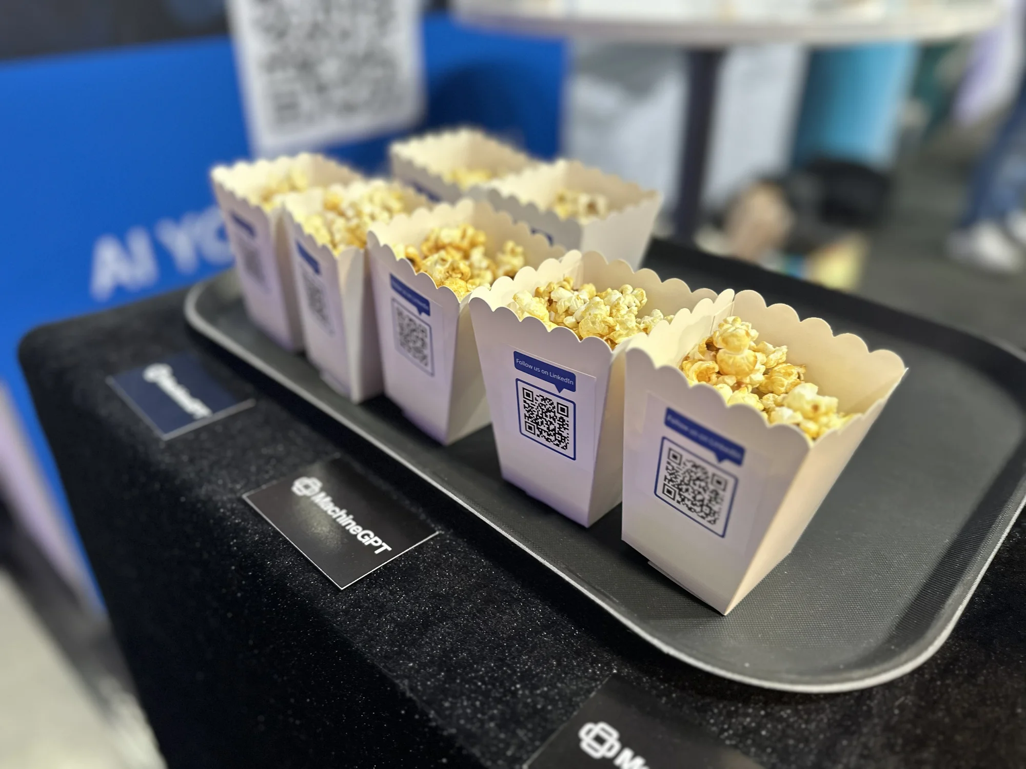 Sensor-equipped popcorn machine as MachineGPT demonstrator at the aiXbrain booth