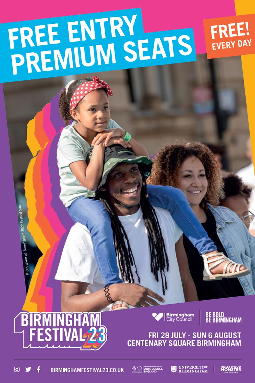 Young family enjoying the festival with daughter on Dad’s shoulders