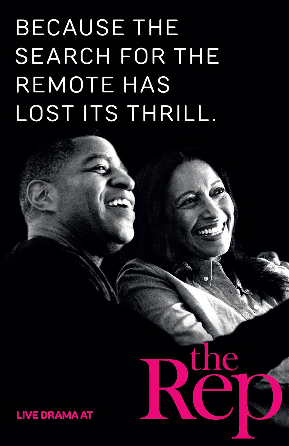 A young couple in the audience enjoying live drama at The Rep