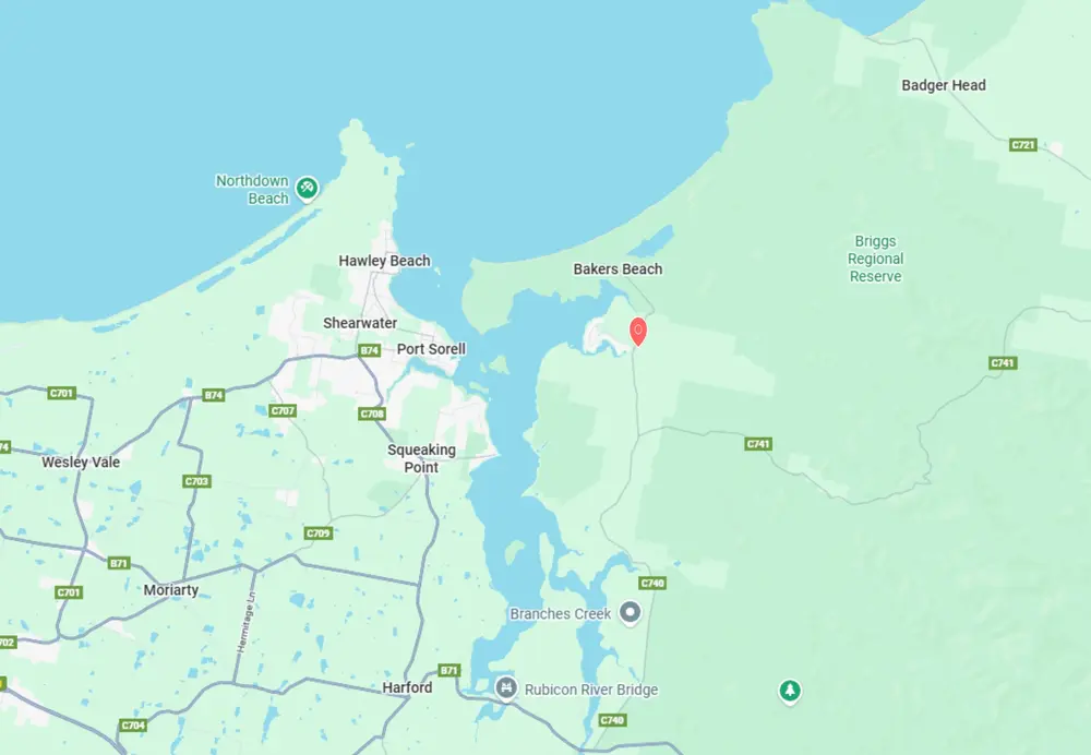 Map showing coastal towns and beaches including Port Sorell, Hawley Beach, Bakers Beach, and Northdown Beach, with roads and landmarks like Rubicon River Bridge and Briggs Regional Reserve.