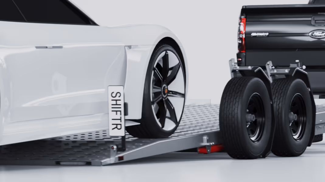 Car driving onto Ground Loading Trailer